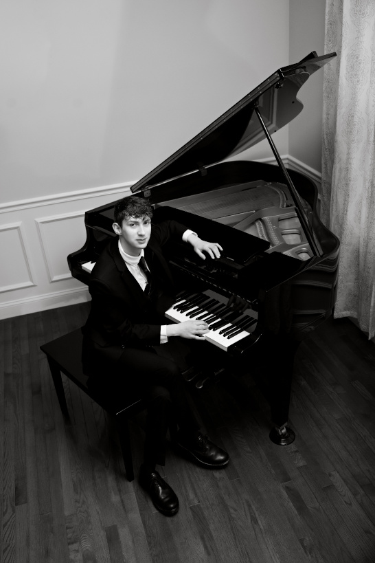 Emmett Axelrod sitting at the piano